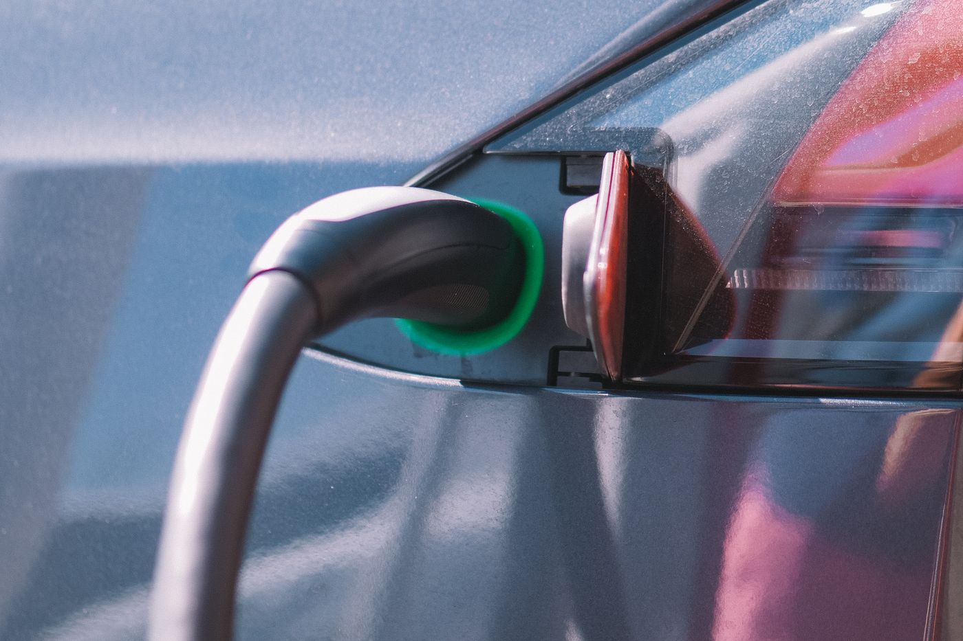 An electric vehicle connected to a charging cable